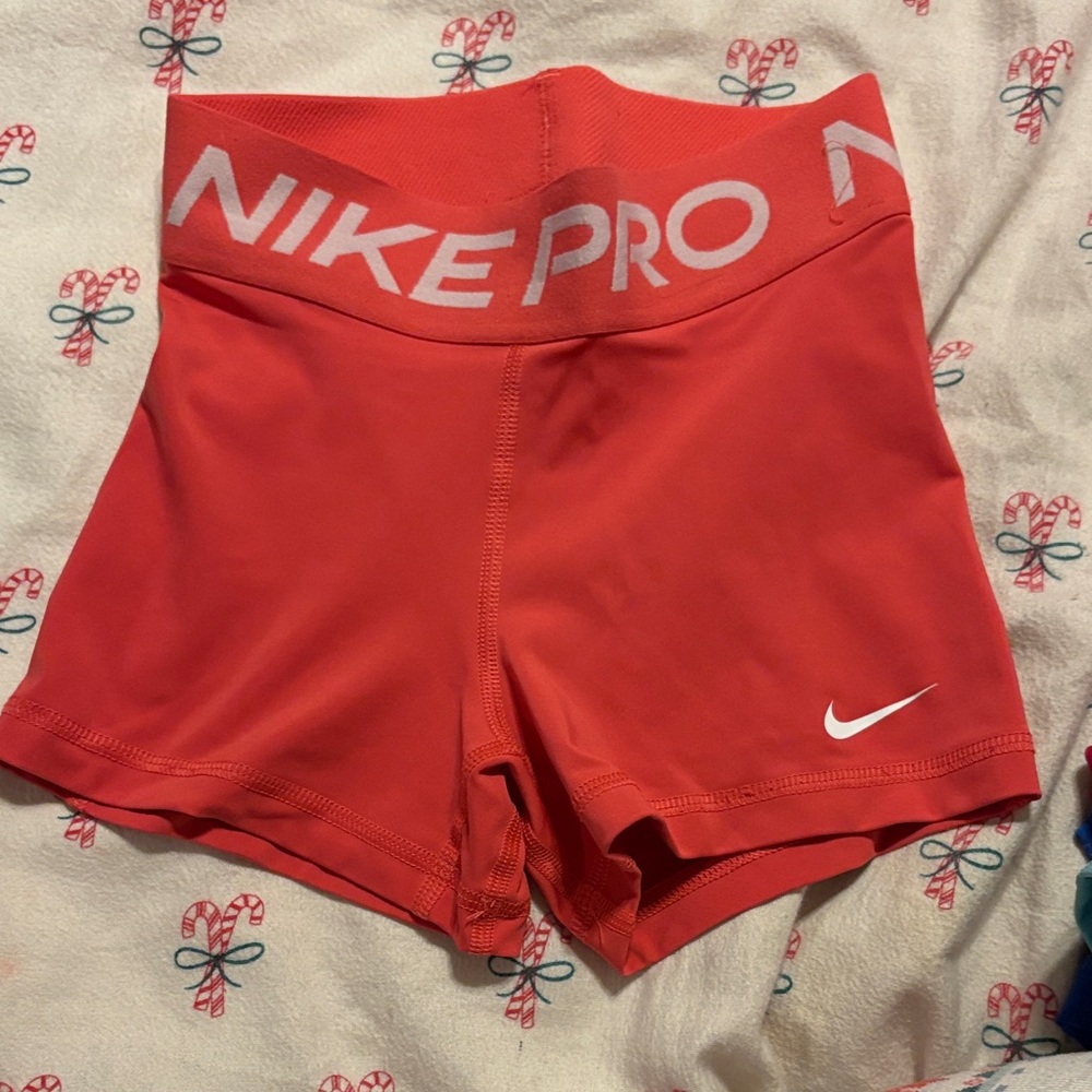 Nike Pro Coral-Red Women's Bike Shorts with White Swoosh